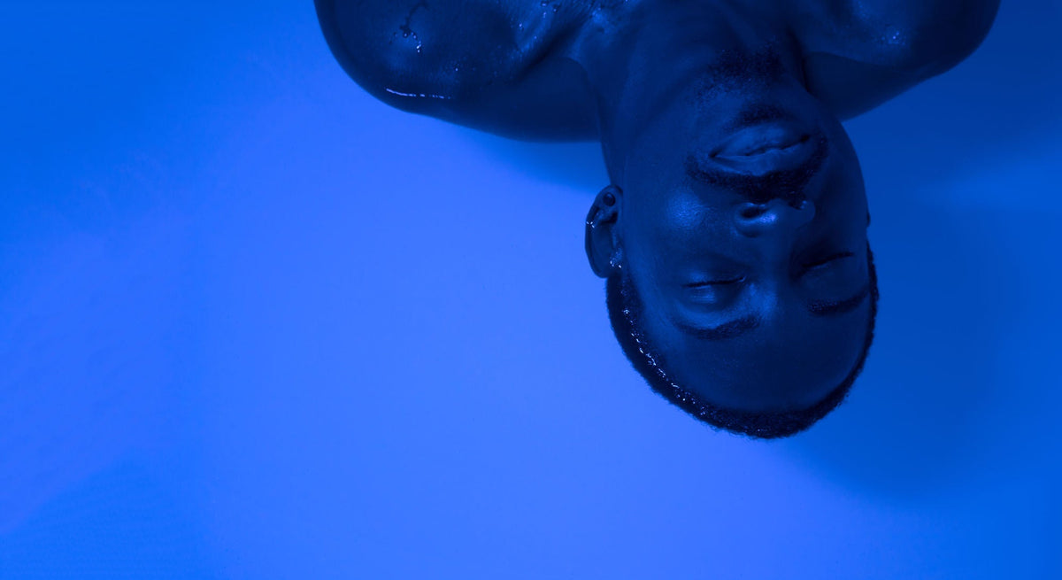 Man floating on back in water of floatation tank for better sleep and insomnia support in London