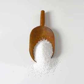 Wooden spoon full of high quality epsom salts used for float therapy