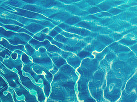 Water ripples from within floatation tank in London