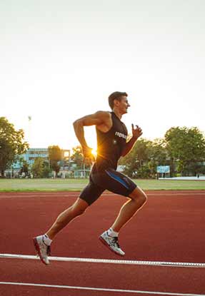 Athletic man running on race track after float therapy session