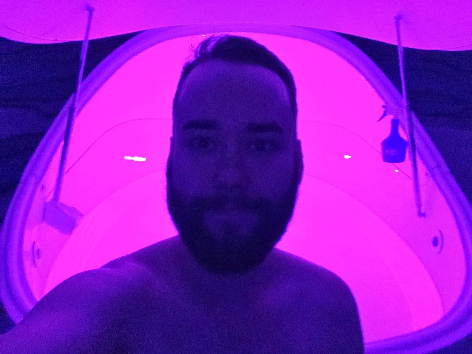 Man standing outside of isolation tank in London float centre